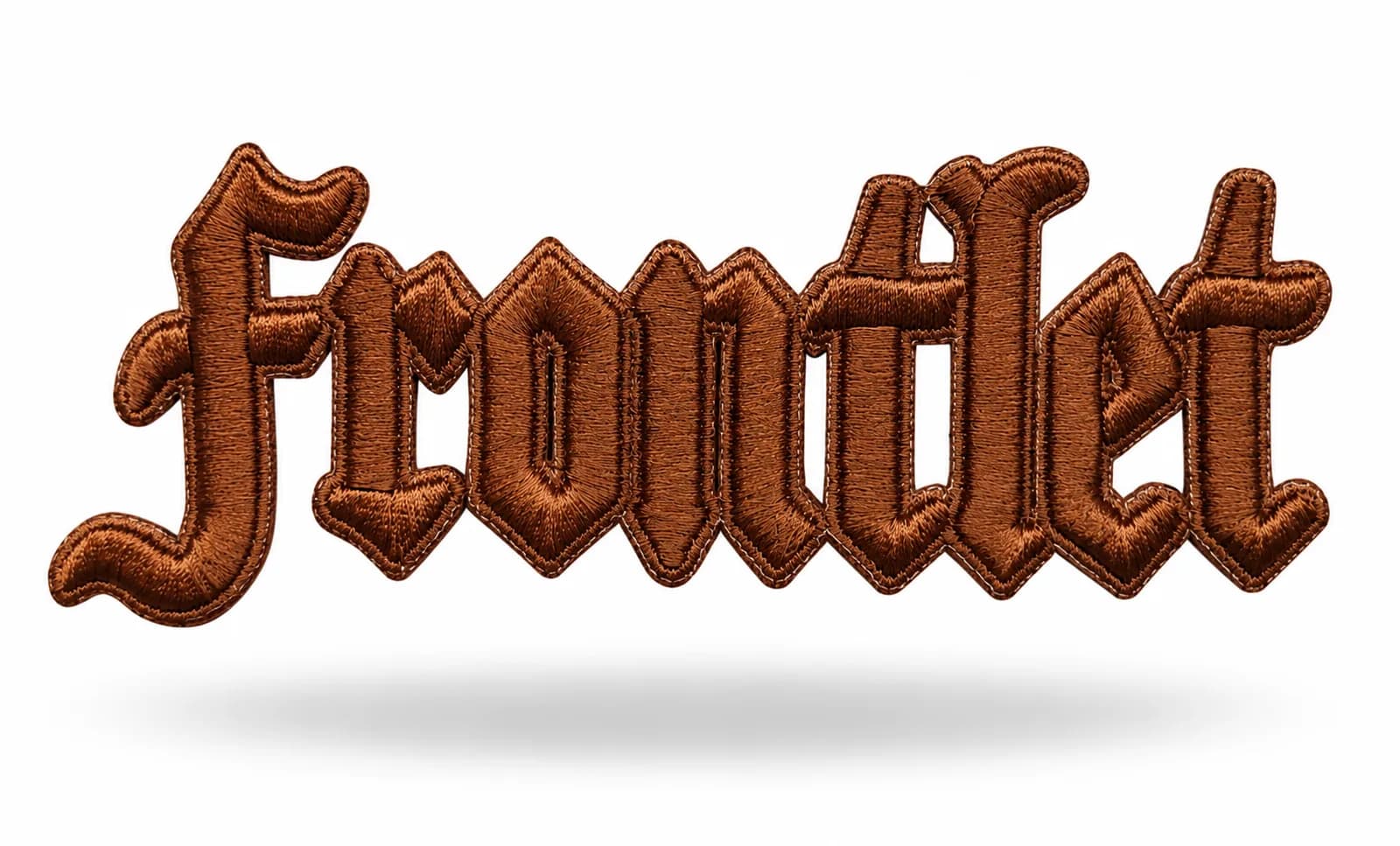 3D puff embroidered lettering in copper thread, the foam underlay raising each letter into a rounded relief