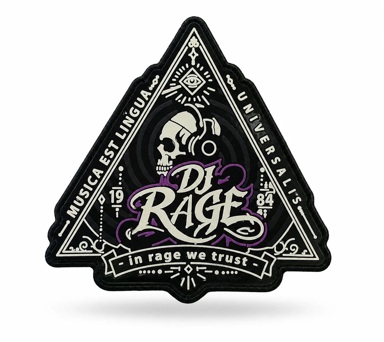 Triangular molded PVC patch in black and cream, showing the raised rubber layers and crisp fine lettering