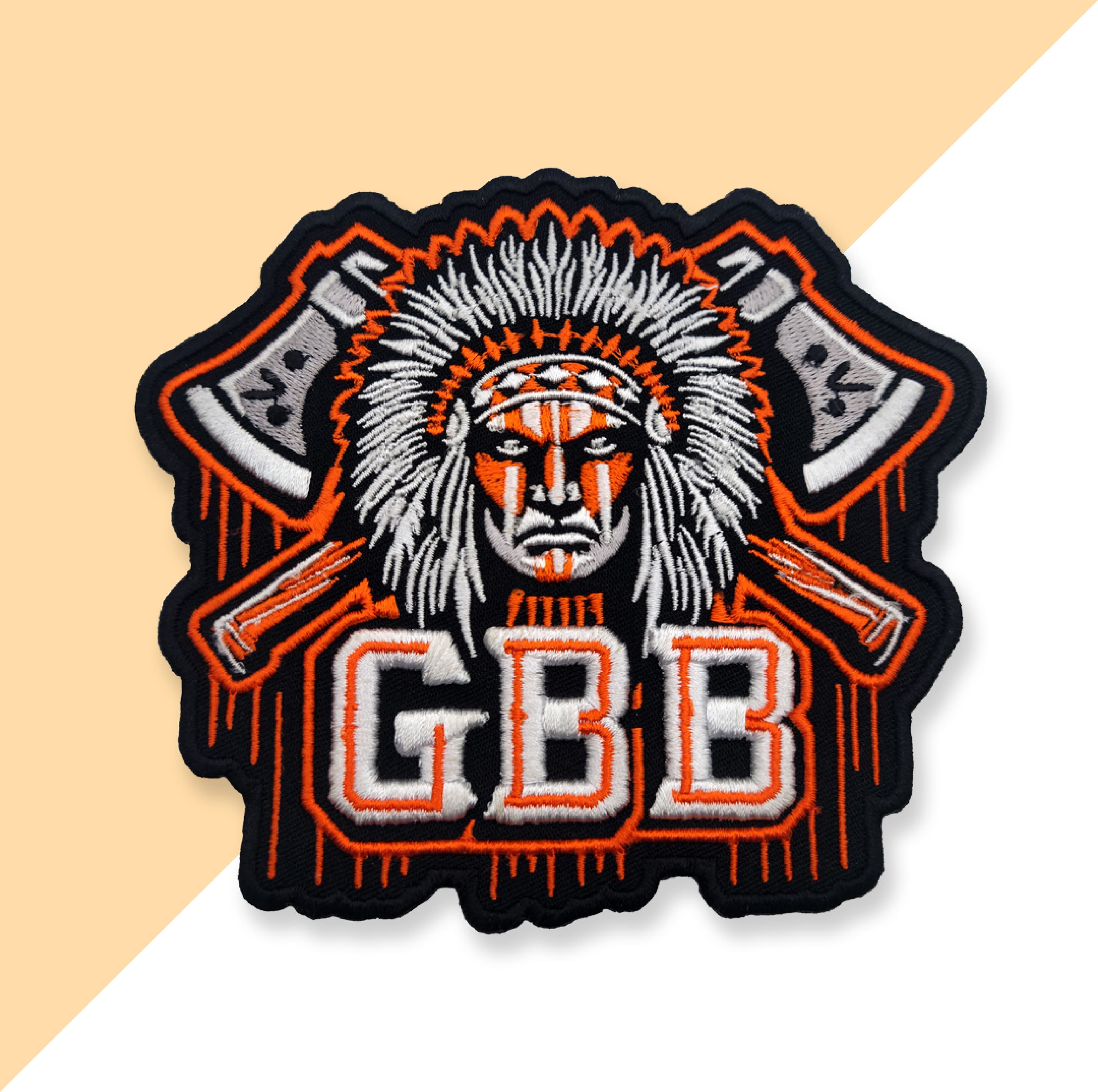 Custom embroidered patch featuring Native American chief headdress design on orange background
