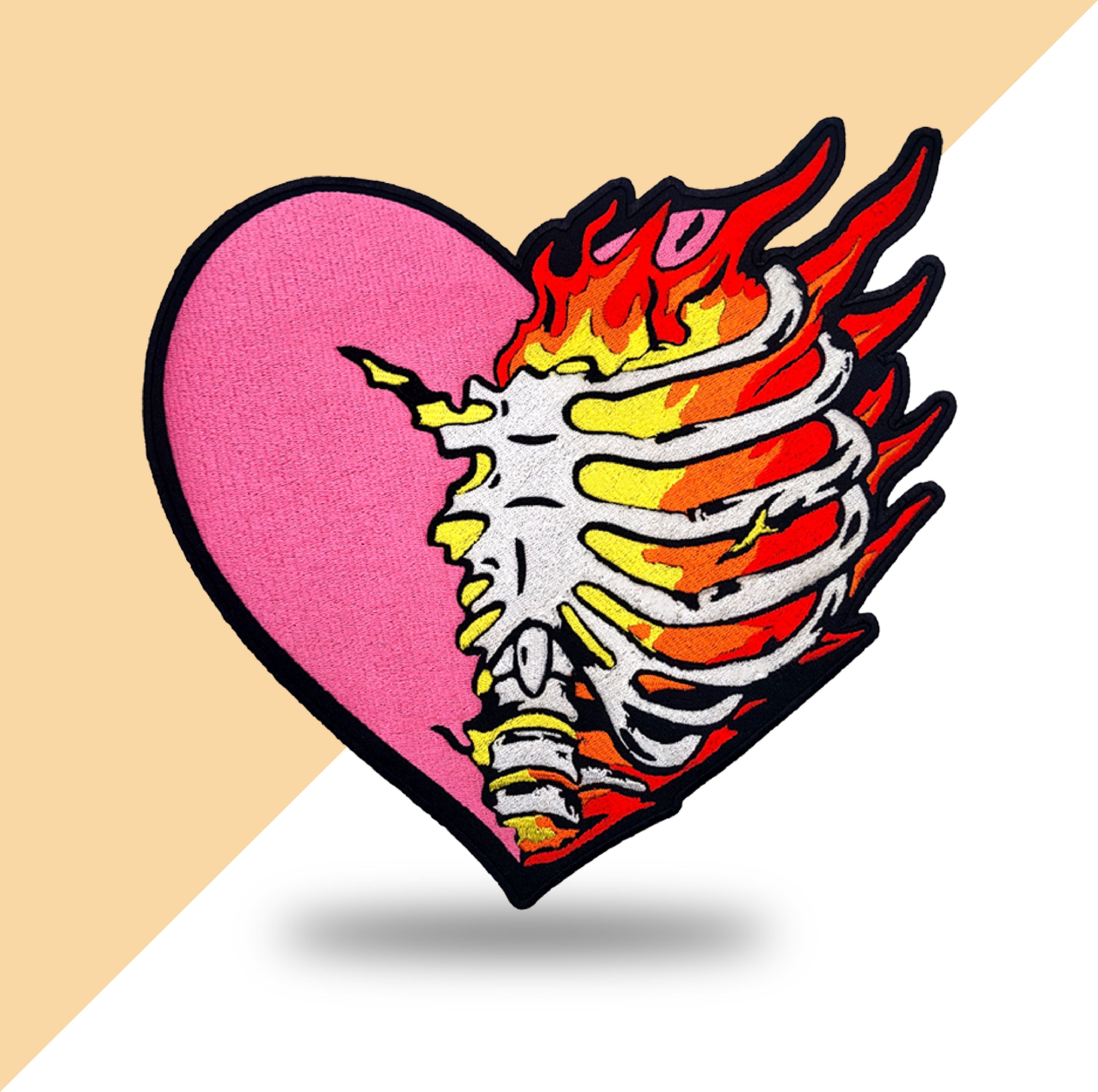 Custom embroidered patch with flaming anatomical heart design in pink and black